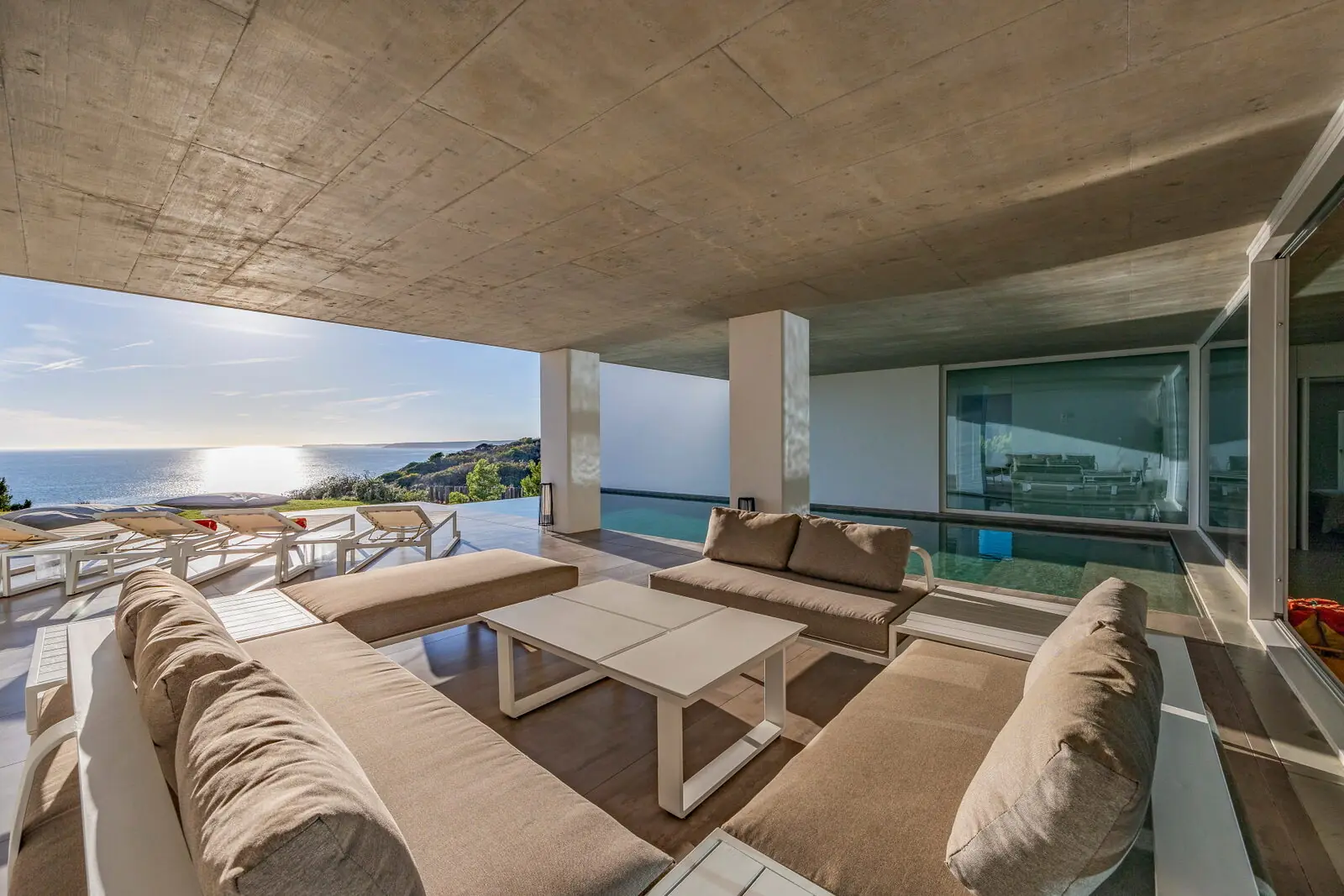 Pool deck and sea view at golden hour